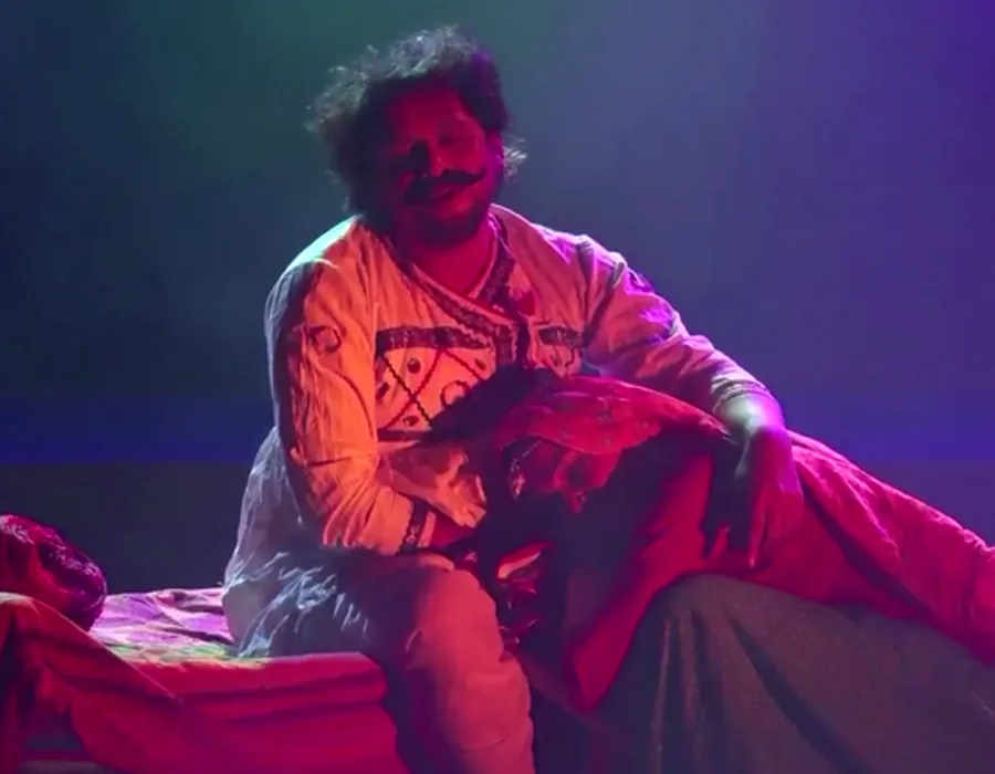 A dramatic theatrical monologue under stage lighting